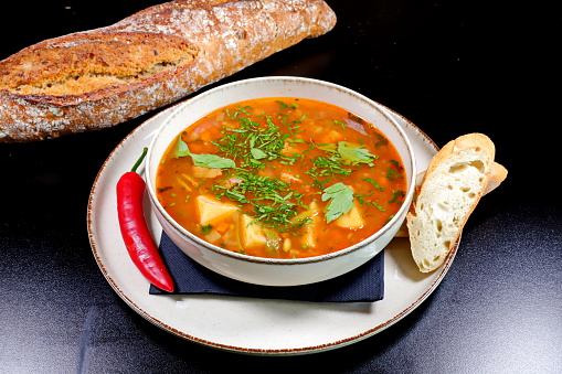 Veal soup with homemade borscht and basel