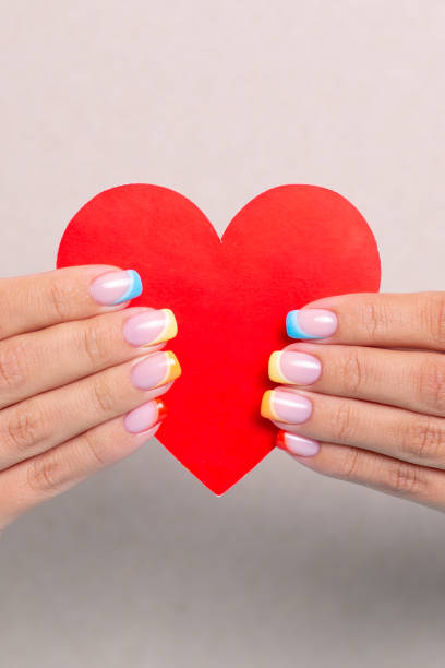 istock Female hands with colourful manicure nails 1507278544