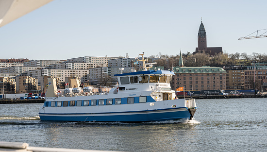 Gothenburg, Sweden - April 21 2023: Passenger ferry Älvsnabben 3 crossing the river.