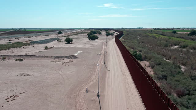 Aerial Drone View Border Wall Between Yuma Arizona and Algodones, Baja California Norte Mexico on a Sunny Day