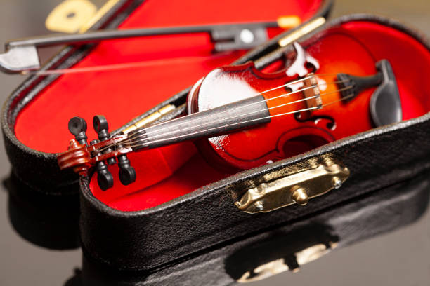 istock violin with bow in red velvet case 1507441359