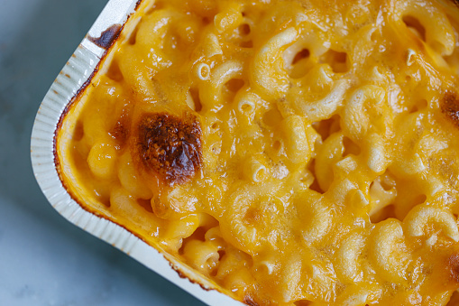 Hearty serving of gluten-free macaroni and cheese using rice pasta and cheddar cheese