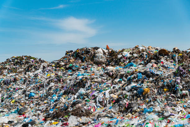garbage dump landscape. city landfill - toxic substance spilling pouring bottle imagens e fotografias de stock