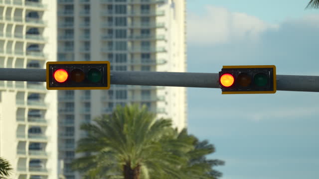 Overhead traffic lights high above street in Miami, Florida