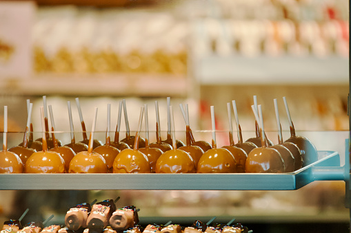 Candied apples in a row background