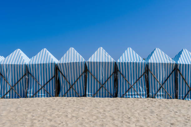 Beautiful blue changing huts on the beach in the summertime in Espinho town, Portugal