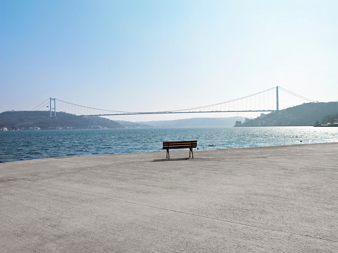 Empty bench in front of Istanbul Bosphorus bridge view in daytime