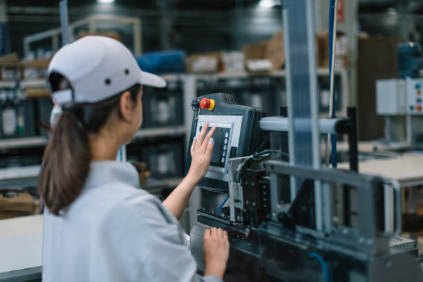 istock Industrial factory female employee operating machine 1507650397