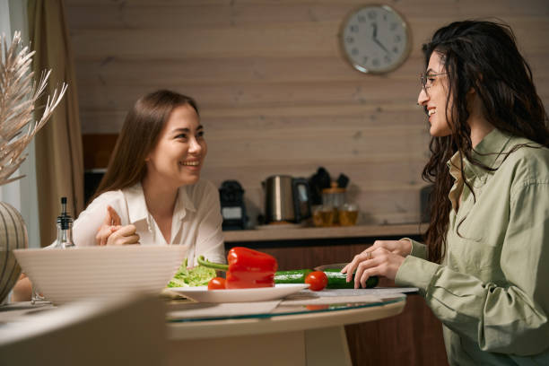 istock Young women cooking and talking in the kitchen 1507671847