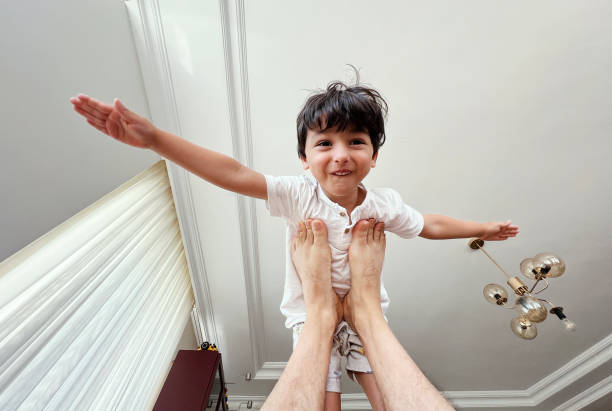 Father and son playing at home