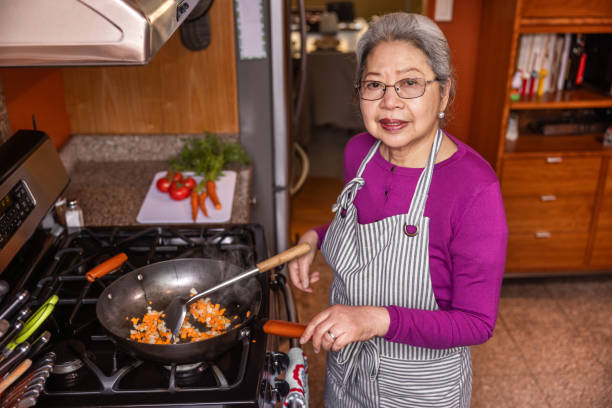 istock Senior Woman Cooking at Home 1507728376