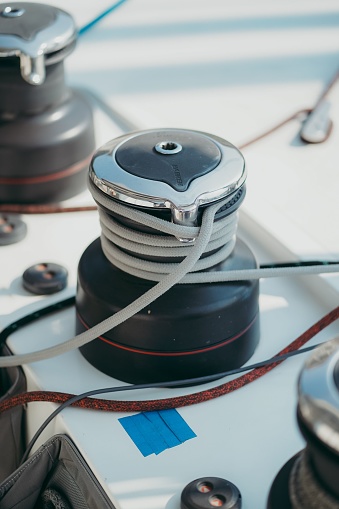 An array of black and silver objects, sitting atop the deck of a boat