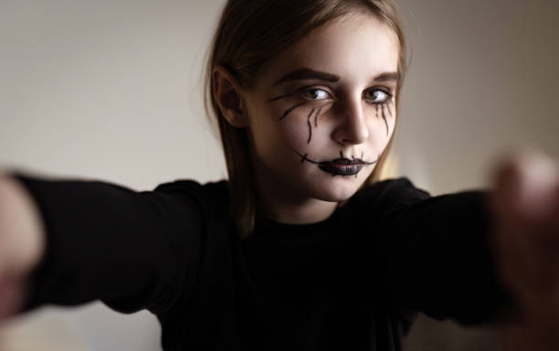 istock Little girl with spooky Halloween makeup 1507781535