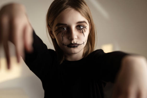 istock Little girl with spooky Halloween makeup 1507781756