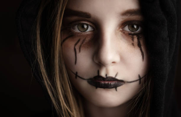 istock Little girl with spooky Halloween makeup 1507782019