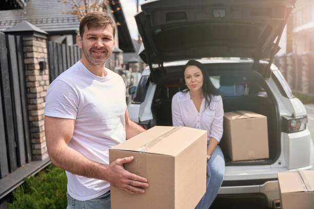 istock Man holding a box in front of his wife 1507782583