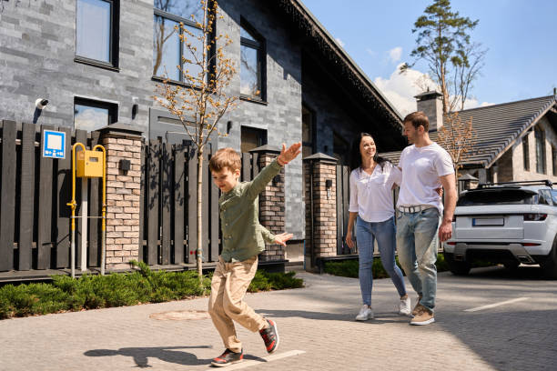 istock Young couple with a child walking down the street 1507783155