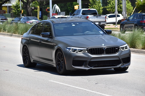 Houston, TX USA - June 28, 2023 - A BMW 5 series sedan on Allen Parkway in Houston