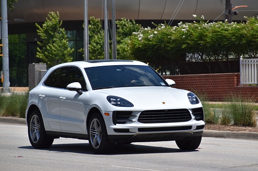 Houston, TX USA - June 28, 2023 - A white Porsche Cayenne S sport utility vehicle
