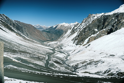 Winding road to mountain pass. High angle view