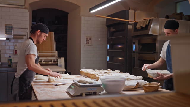Pastry Chef Putting Bread Into Wicker Bowls For Proofing