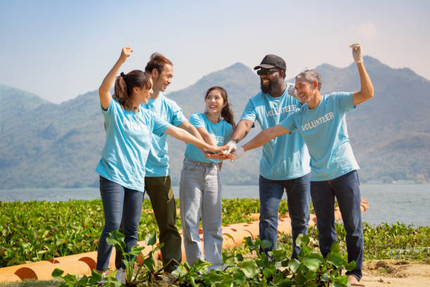 istock multiracial volunteers group hands stack together while dredging water hyacinth in the river 1507964883