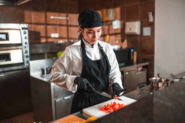 istock Woman Dices Red Peppers for a Recipe 1507973766