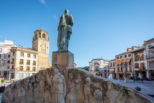 Ubeda, Spain - Jun 2, 2019: General Leopoldo Saro Marin Monument and Clock Tower (Torre del Reloj)  at Plaza Andalucia Square - Ubeda, Jaen, Spain