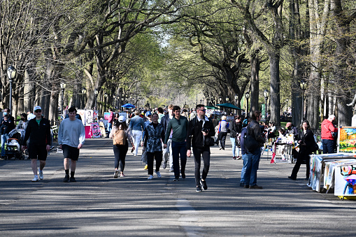 New York, USA, April 10, 2023 - Tourists and locals stroll along the Mall and Literary Walk in Central Park, midtown Manhattan, New York City.