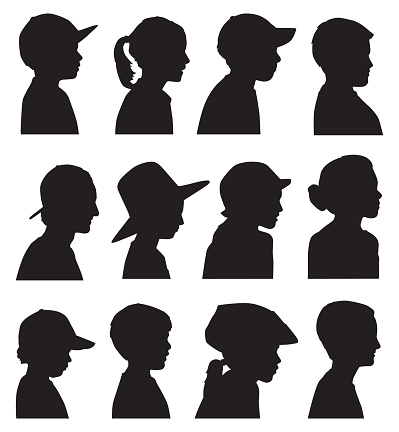 Vector silhouettes of twelve children head profiles.