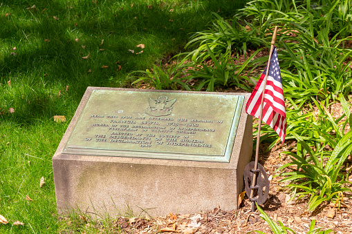 New York, New York, USA - June 20, 2023: This image shows the grave marker of Francis Lewis, one of the signers of the Declaration of Independence, in the cemetery of Trinity Church in Manhattan in New York City.