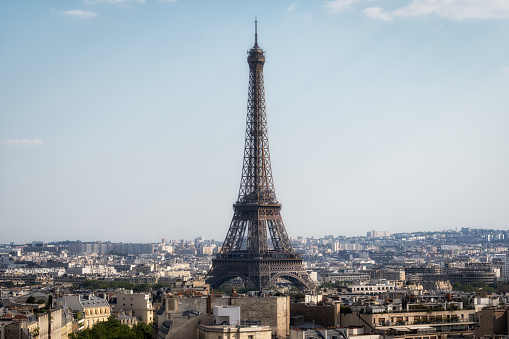 Eiffel Tower viewed from top of Arc de Triomphe. Famous landmark in Paris, France.