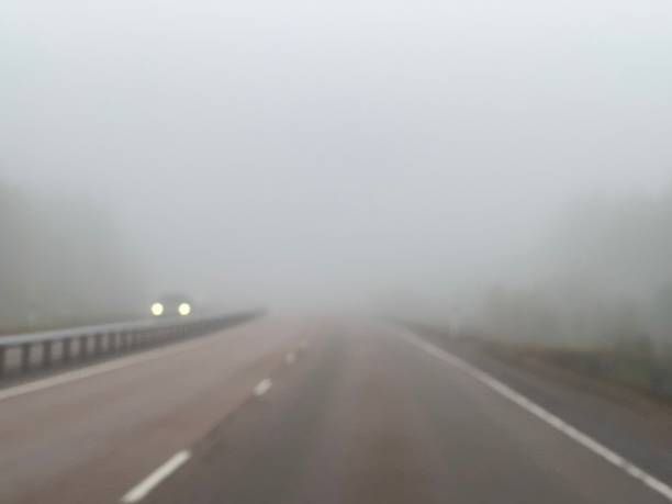 istock Fog highway road driving car lights danger 1508319075