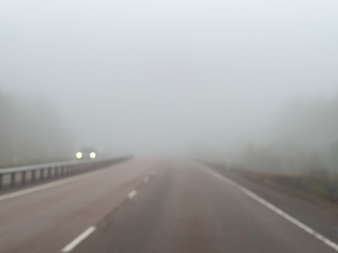 Fog highway road driving car lights danger