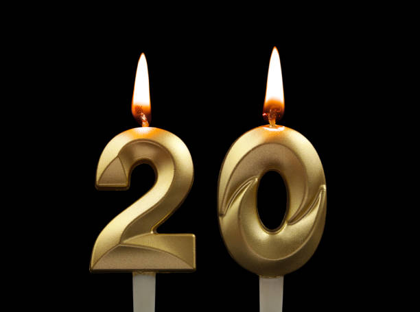 istock Gold birthday candles isolated on black, number 20 1508412957