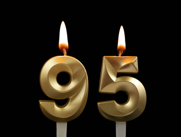 istock Golden birthday candles isolated on black background, number 95 1508414596