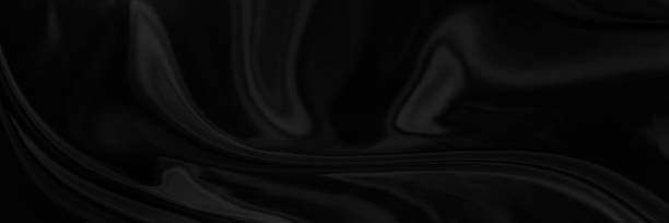 istock Black gray satin dark fabric texture luxurious shiny that is abstract silk cloth panorama background with patterns soft waves blur beautiful. 1508427600