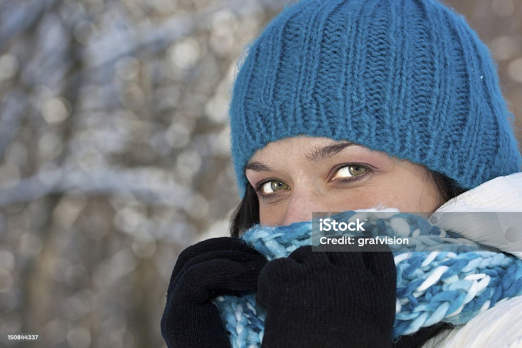 Cold winter woman Cold winter woman covering her face in winter forest. Adult Stock Photo