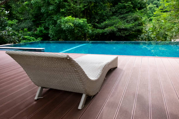 istock Deckchairs or sun bed on terrace with blue swimming pool. 1508446246
