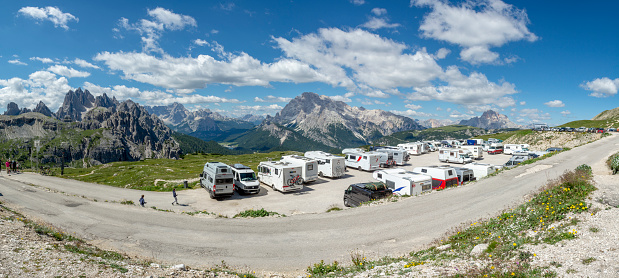 The Tre Cime di Lavaredo, Dolomites, Italy - July, 6,  2022 : The parking place at Rifugio Auronzo. Tre Cime di Lavaredo.