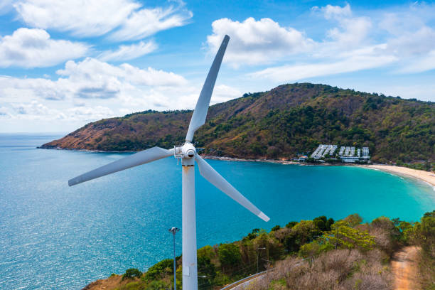 istock Wind turbine on mountain and blue ocean background with copy space for text. 1508475051