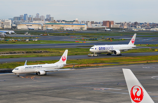 Tokyo, Japan - Nov 2, 2019. Passenger airplanes taxiing on runway of Tokyo Haneda Airport (HND). Haneda handled 87,098,683 passengers in 2018.