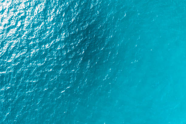 istock blue ocean waves background. Water surface on ocean. copy space area for text. Reflection on the surface of the ocean on a calm day. 1508477809