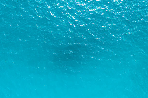 istock blue ocean waves background. Water surface on ocean. copy space area for text. Reflection on the surface of the ocean on a calm day. 1508478335
