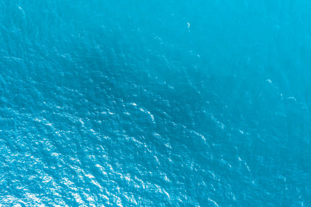 istock blue ocean waves background. Water surface on ocean. copy space area for text. Reflection on the surface of the ocean on a calm day. 1508478504