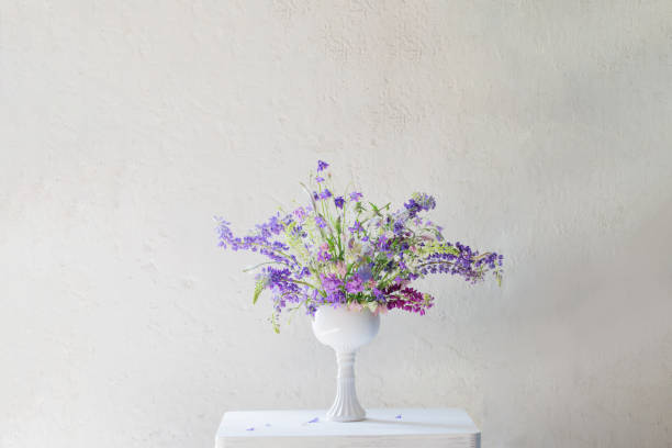 summer bouquet in blue and violet colors on white background