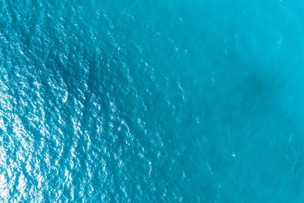 blue ocean waves background. Water surface on ocean. copy space area for text. Reflection on the surface of the ocean on a calm day.