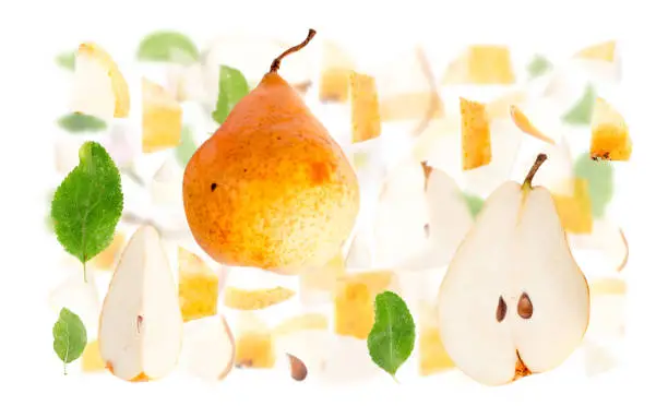 Abstract background made of Orange Pear fruit pieces, slices and leaves isolated on white.