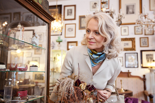 Senior woman shopping in an antiquity storehttp://bit.ly/183kyid