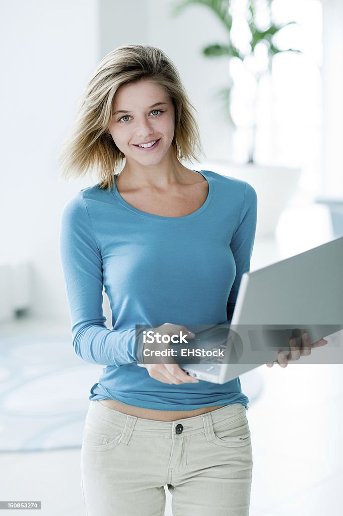 Woman with Laptop Computer Woman with Laptop Computer *slight blur* Young Women Stock Photo